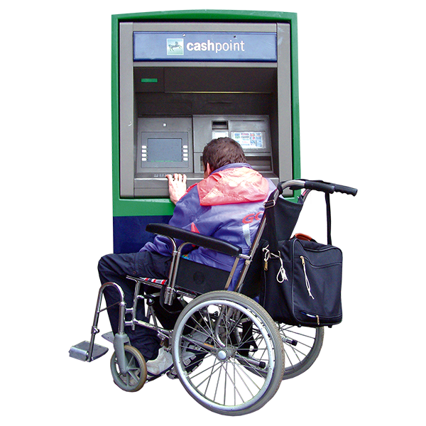 A person in a wheelchair using a cash point.